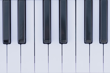 Fototapeta premium Black and white keys of a keyboard, providing a geometric pattern and musical composition