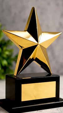 Shiny gold trophy star award on display. Vertical design emphasizes achievement and recognition. Perfect for celebrating success and motivation.