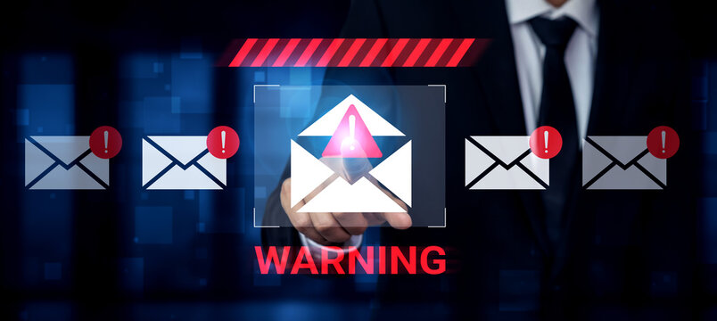 A businessman wearing a suit interacts with a digital screen displaying a warning about email notifications, emphasizing the importance of cyber security in today business environment. Gantry - Powered by Adobe