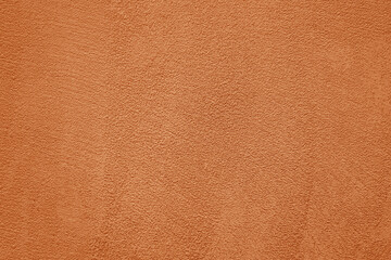 peach fuzz pink brown cement in plaster concrete wall texture background, cement wall backdrop. Textured Plaster Wall Background. close-up of  textured plaster wall with an abstract rough surface.