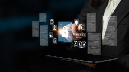A business professional engages with a holographic interface displaying digital security icons, emphasizing the importance of data protection and cybersecurity in modern enterprises. Gantry