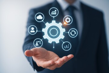Innovation in Hand: A professional's hand cradles a symbolic gear, representing technological advancements, data analysis, and business process automation.