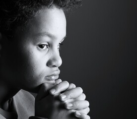 little boy praying to God with hands together with people stock image stock photo 