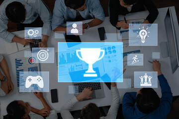 A group of professionals collaborates in a modern office space, surrounded by business charts and conceptual icons highlighting themes of innovation and success. Trope