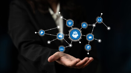 A hand depicts a digital network with interactive icons representing technology, communication, and collaborative business strategies in a modern context. Tessel