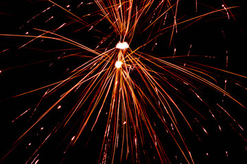 Flying Sparks Explosion on Black Background Abstract Light Trails