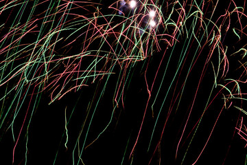 Colorful beams of light dance across space to depict festive and energetic movements