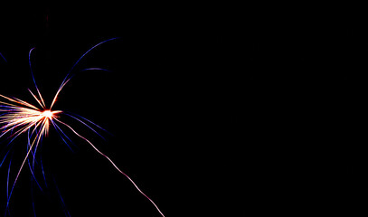 Bright sparks illuminate dark night, Single firework creates mesmerizing visual display