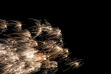 City fireworks illuminate midnight sky, Urban celebration lights burst across darkness