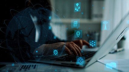 A modern workspace featuring a person interacting with a laptop. Digital icons float around, symbolizing connectivity, communication, and data in a high-tech environment. Xenic