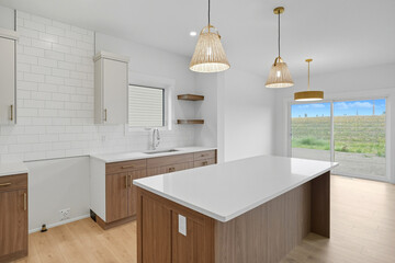 Kitchen with a white island and a window