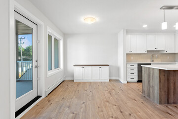 Fototapeta premium Large open kitchen with a wooden island and a sink