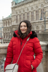 Fototapeta premium Portrait of a middle aged woman in red winter jacket