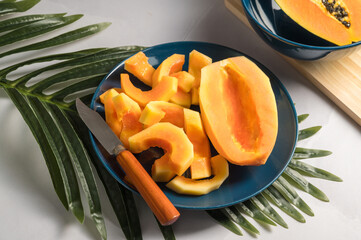 Papaya exotic fruit slices on plate. Healthy vegan food.