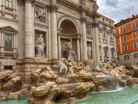 Trevi fountain rome italy baroque architecture marble statues of oceanus with horses and tritons in water outdoor landmark concept of tourism, italian heritage, history