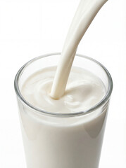 Stream of Fresh Milk Pouring into a Clear Glass