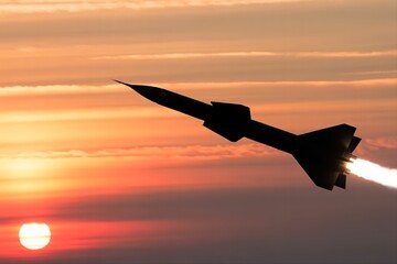 missile fly against sunset sky with flame jet. Modern warfare attack