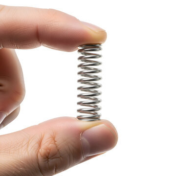 Closeup of a hand holding a small metal spring isolated on transparent background