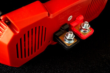 Red electric shocker on a black background. Close-up.
