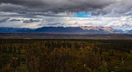 Sun shining on mountains on the Denali Highway