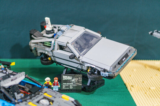 Lego collection with a DeLorean from Back to the Future and USS Enterprise Star Trek model, on a green fabric-covered table - Kyiv, Ukraine - June 7, 2025