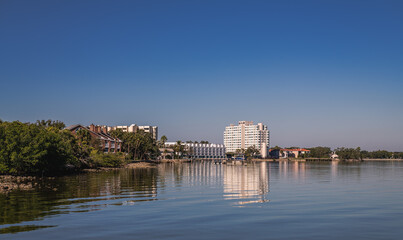 Condos by the sea, reflection in calm waters. Tampa Bay Florida