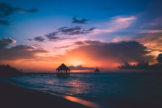 Silhouette of a pagoda on a beach at sunset, Akumal, Tulum, Riviera Maya, Quintana Roo, Mexico