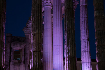Temple of diana columns illuminated purple at night in merida © larrui