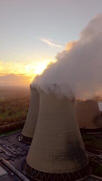 Aerial view of power station chimney with pollution emissions