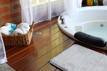Whirlpool bath in a romantic space surround by a wood deck and nature view