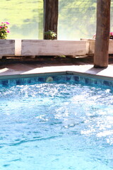 Whirlpool bath in a romantic space surround by a wood deck and nature view