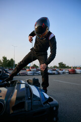 Go-kart racing scene with a racer preparing to take off on a kart track
