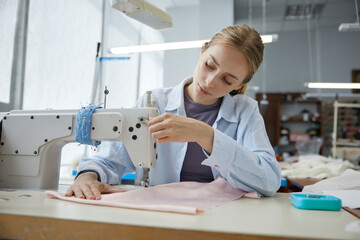 Seamstress at work expertly crafting unique garments with tender care