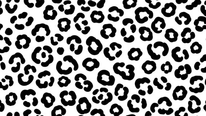 Fototapeta premium Black and white image depicting a leopard print pattern, with distinct spots.