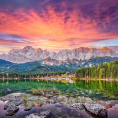 Astonishing autumn landscape of Eibsee Lake in front of Zugspitze summit under sunset
