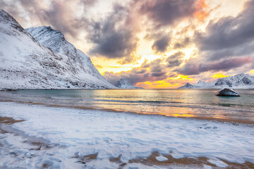 Unbeliveble winter view of Vik beach during sunset with lots of snow  and snowy  mountain peaks near Leknes.