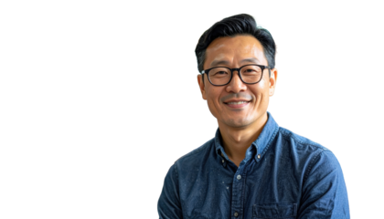 Portrait Of Smiling Asian Man Wearing Glasses And Blue Denim Shirt Against Transparent Background Head And Shoulders Studio Shot Confident Expression