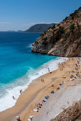 Aerial view of Kaputaş Beach, a famous beach with its turquoise water meets a small sandy-pebble beach between Kaş and Kalkan, Antalya, Turkey.