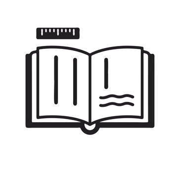 An open book with a ruler on top is lying on a desk in a quiet library environment.