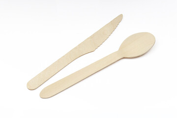 one-time use wooden spoon and knife isolated on white background