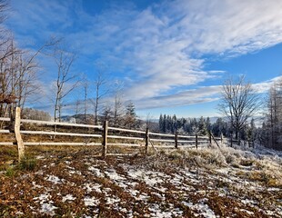 winter mountain landscape with fence