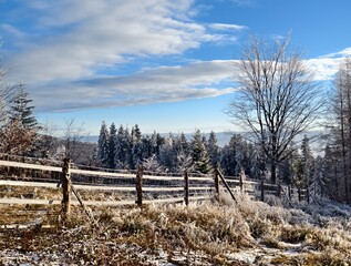 winter mountain landscape with fence