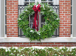 Natural pine wreath for Christmas, decorating window