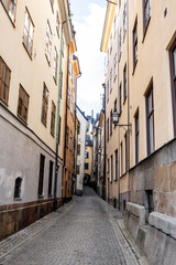 Fototapeta premium A street lined with colorful houses in Stockholm's historic Gamla Stan district.. Sweden, Stockholm\