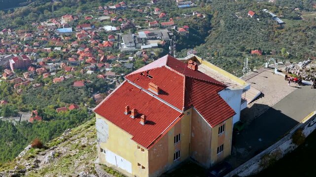 Aerial video from Sari Salltik viewpoint looking down at the historic city of Kruj&euml; and surrounding green hills of Albania.