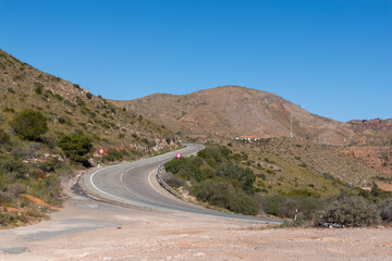 A road with a red sign on it