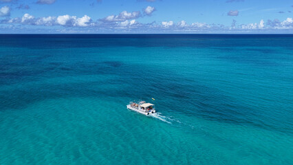 Naklejka premium Cruise Tour At Providenciales In Turks And Caicos Islands. Grace Bay Scenery. Tropical Scene. Stunning Caribbean Sea. Cruise Tour In Turks And Caicos Islands. 