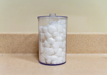A container with cotton balls at a medical office