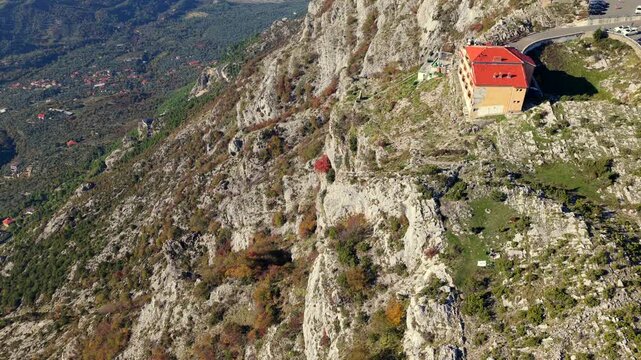 Aerial video from Sari Salltik viewpoint looking down at the surrounding green hills of the historic city of Kruj&euml; of Albania. 
