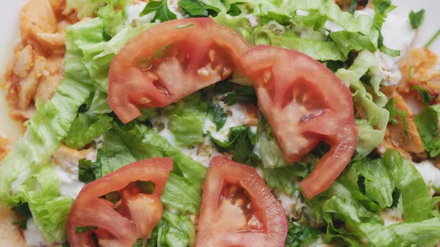 Close-Up of Chicken Kapsalon with Turkish Doner on White Plate